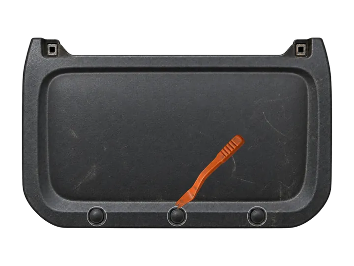 Black dashboard knee panel with three push clips seen from below