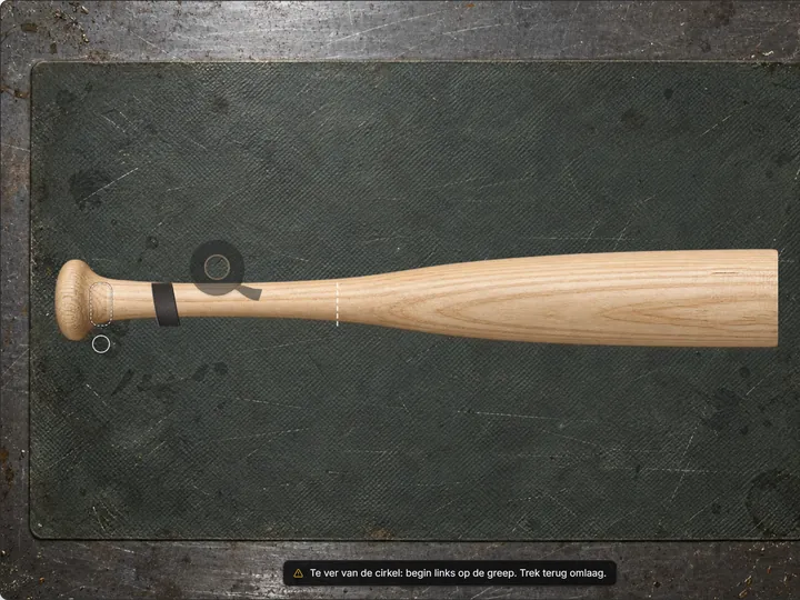 Black grip tape starting to wrap the handle of a wooden bat