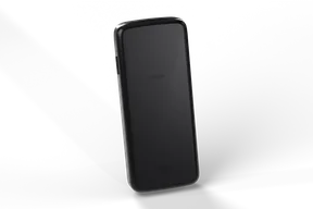 Back of the black burner phone with the battery cover seam and a small speaker grille
