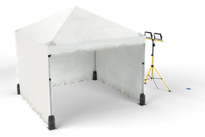 White 3 x 3 m forensic tent with an open front and a yellow tripod work light with two lit LED panels beside it